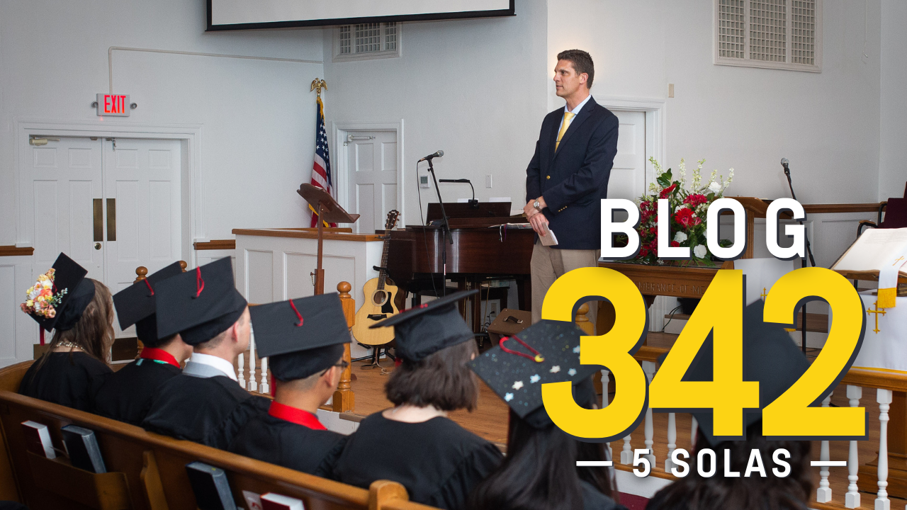 Christian heritage school five solas graduation ceremony with students sitting facing front with jeff schapansky addressing them
