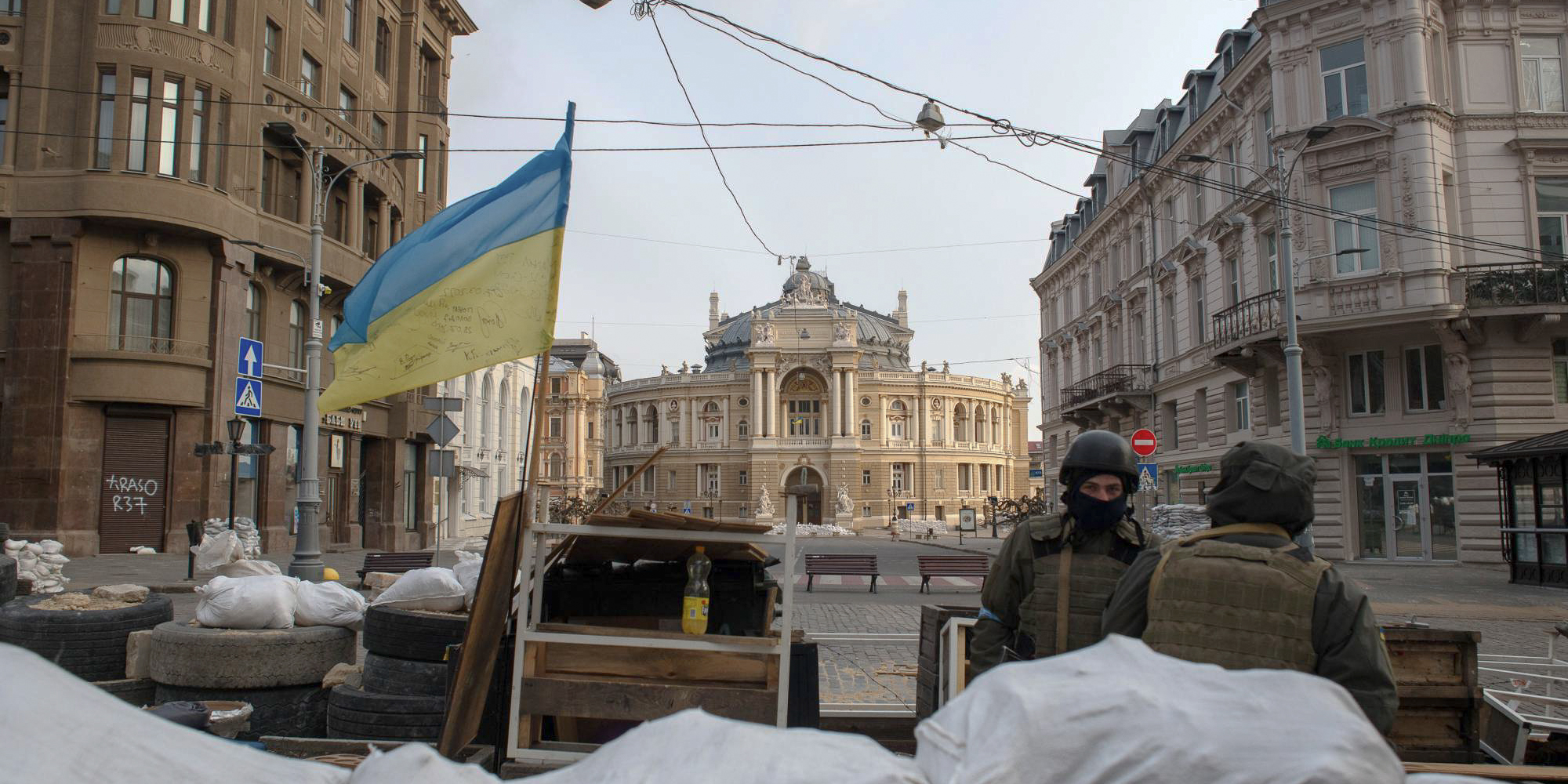 Ukraine's historic downtown building flocked with people and flags in support of their country